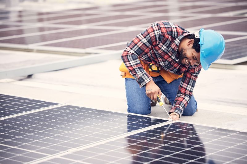 Technicians working on solar panels